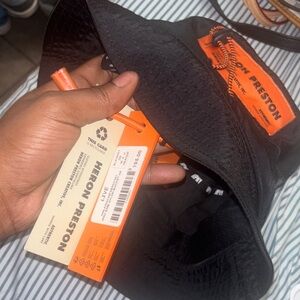 Heron Preston Black Hat with Vibrant Orange Details